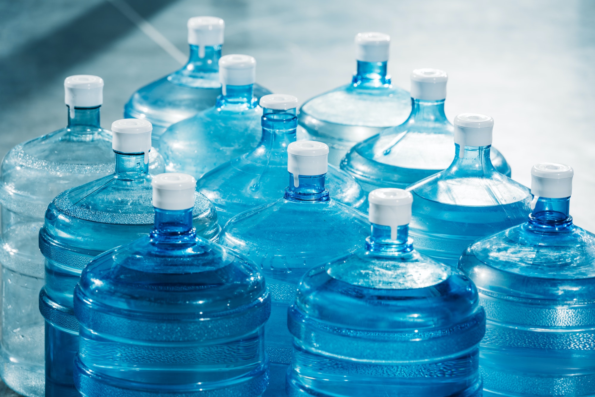 plastic-large-blue-water-bottles-on-floor.jpg