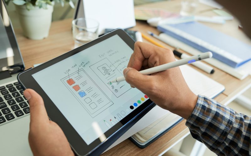 ui-designer-drawing-sketch-of-mobile-app.jpg
