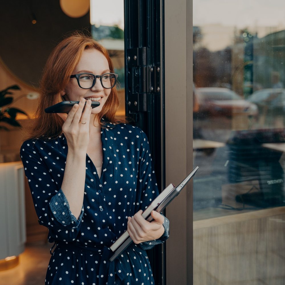 young-woman-makes-voice-call-uses-modern-technologies-for-communication.jpg