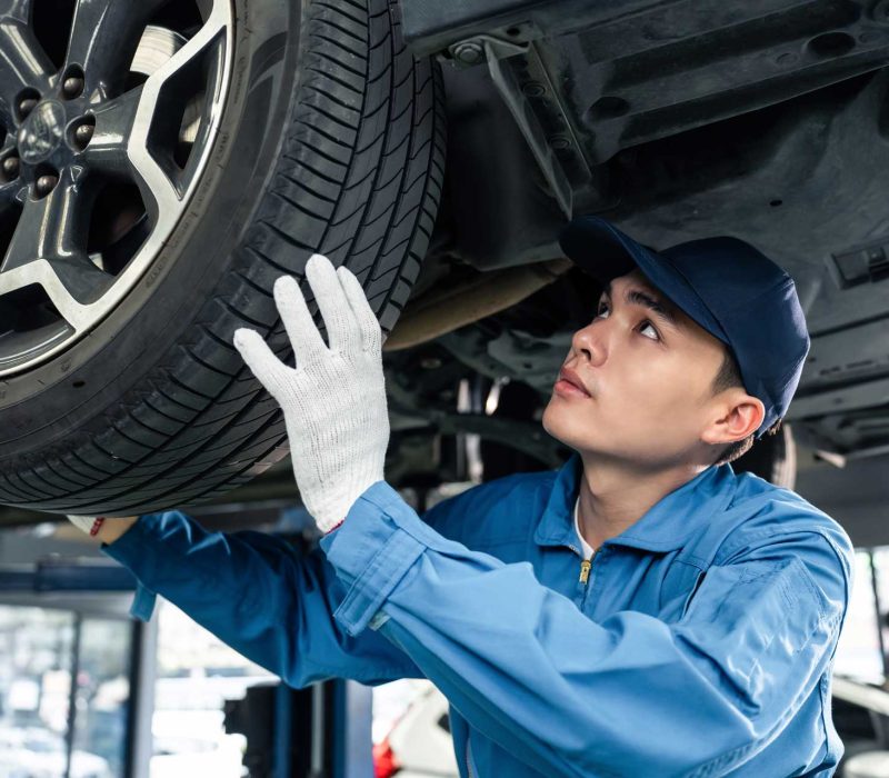 asian-automotive-mechanic-repairman-look-under-car-N3DC7P3.jpg