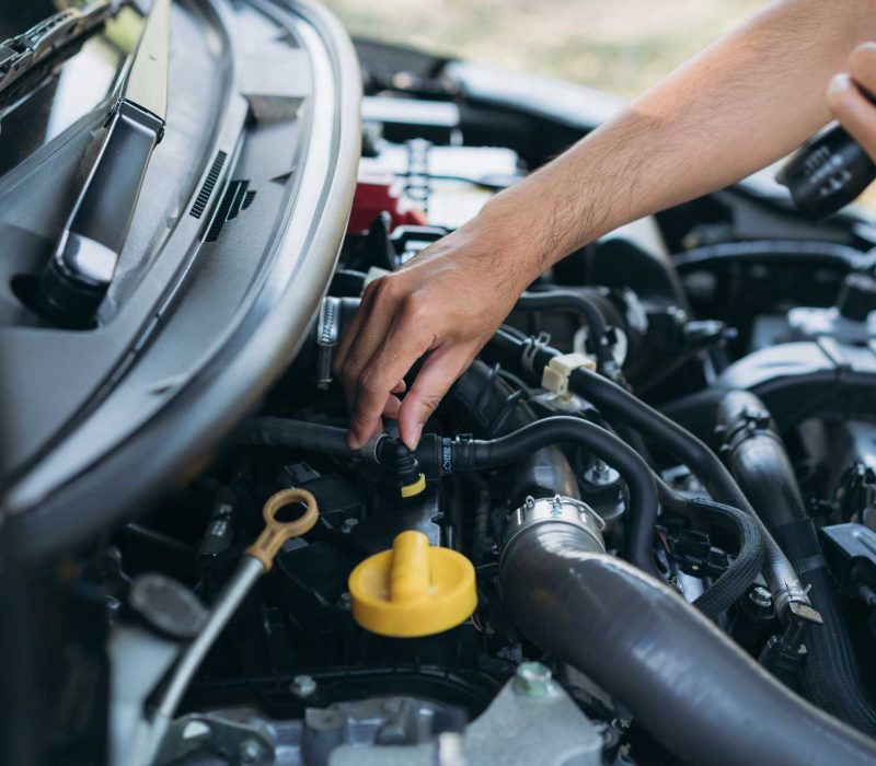 young-man-checking-and-maintenance-on-his-car-car-Q6GA6P2.jpg