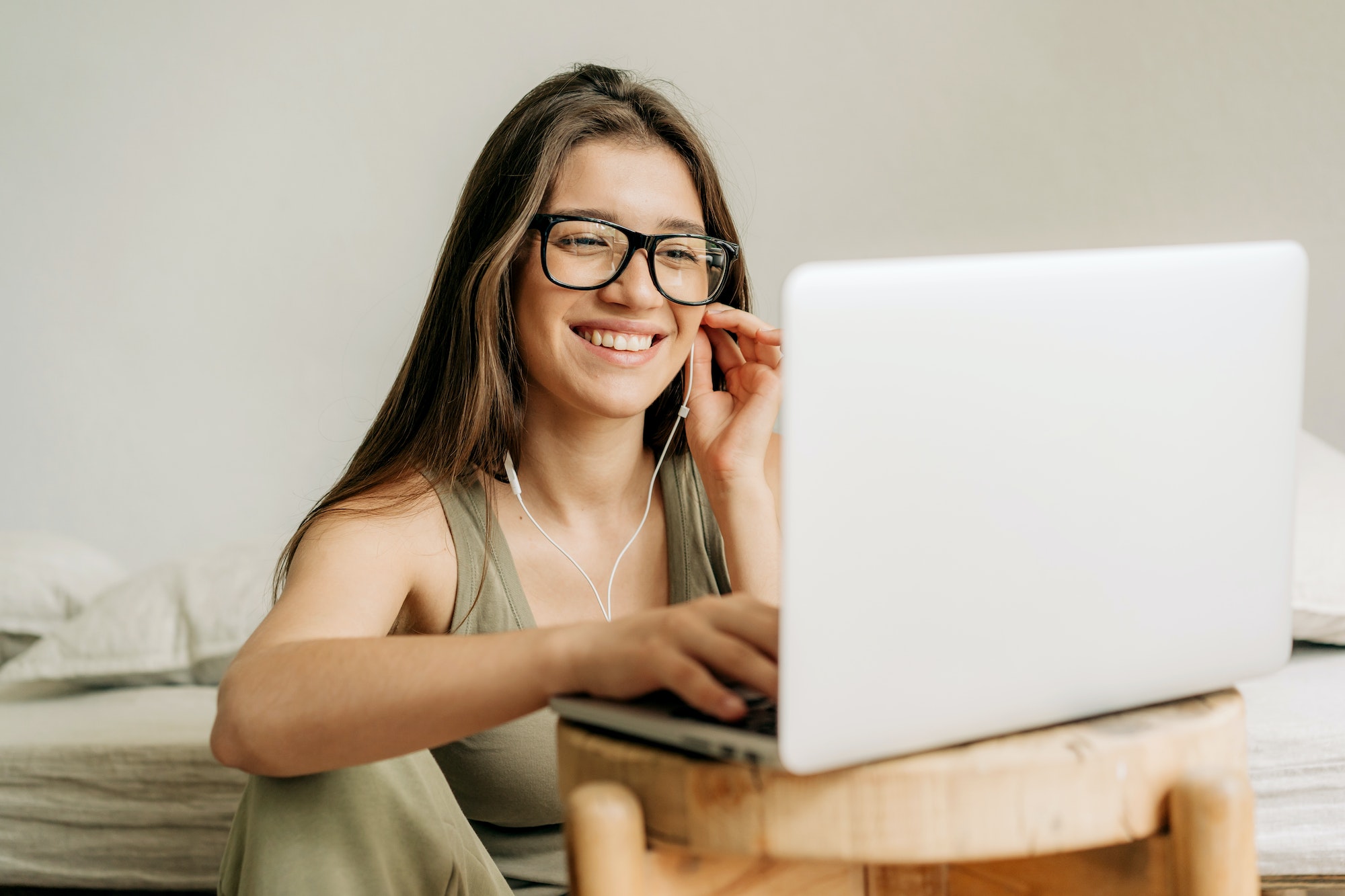 freelancer-woman-at-online-meeting-using-laptop-and-headphones-.jpg