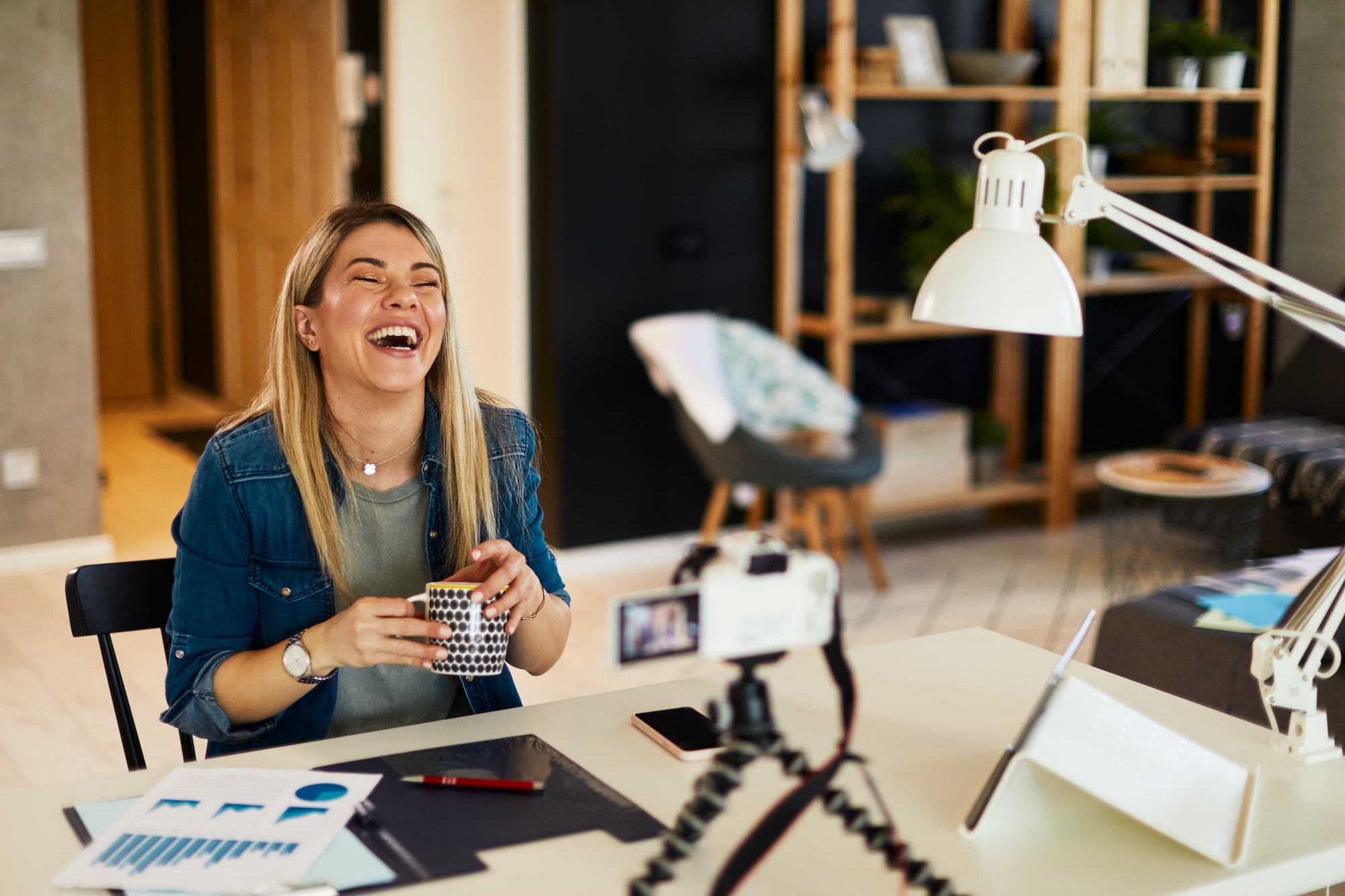 young-business-woman-recording-video-for-her-vlog-at-home-.jpg