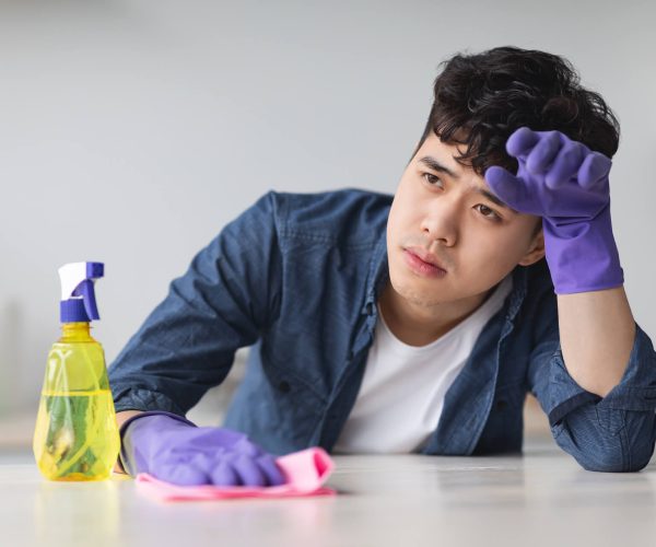 tired-asian-guy-with-dust-cloth-looking-at-copy-sp-2021-09-02-21-29-05-utc.jpg