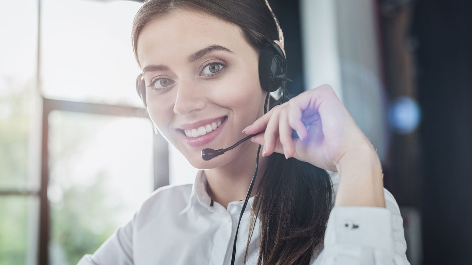 beautiful-female-call-center-worker-with-headphone-2023-11-27-05-21-47-FDF6X5G.jpg