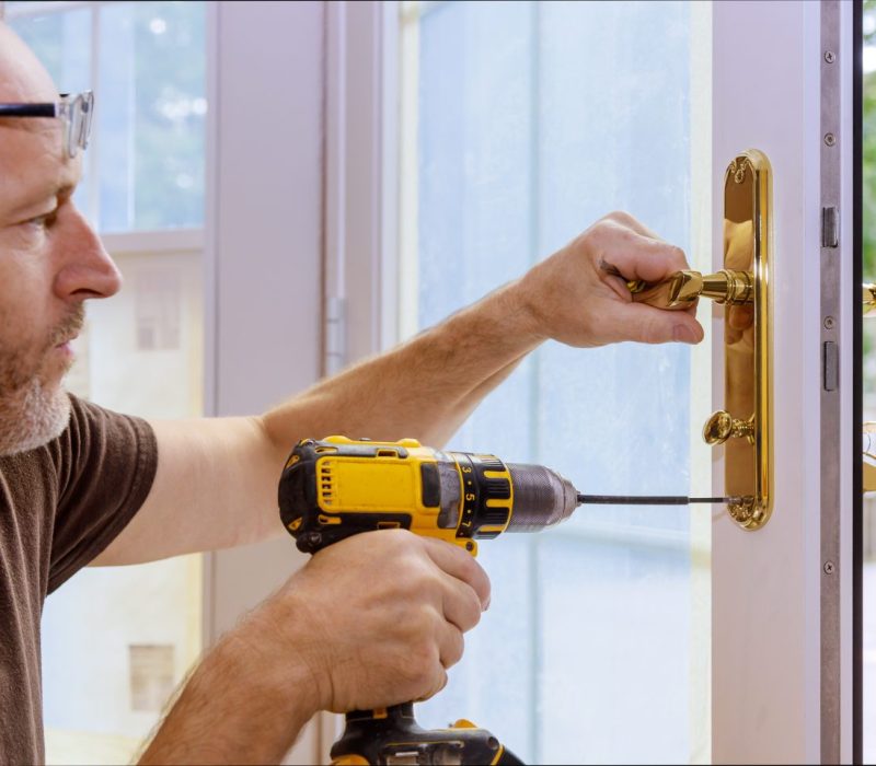 closeup-of-a-professional-locksmith-installing-or-repairing-a-new-deadbolt-lock-e1696769095638.jpg