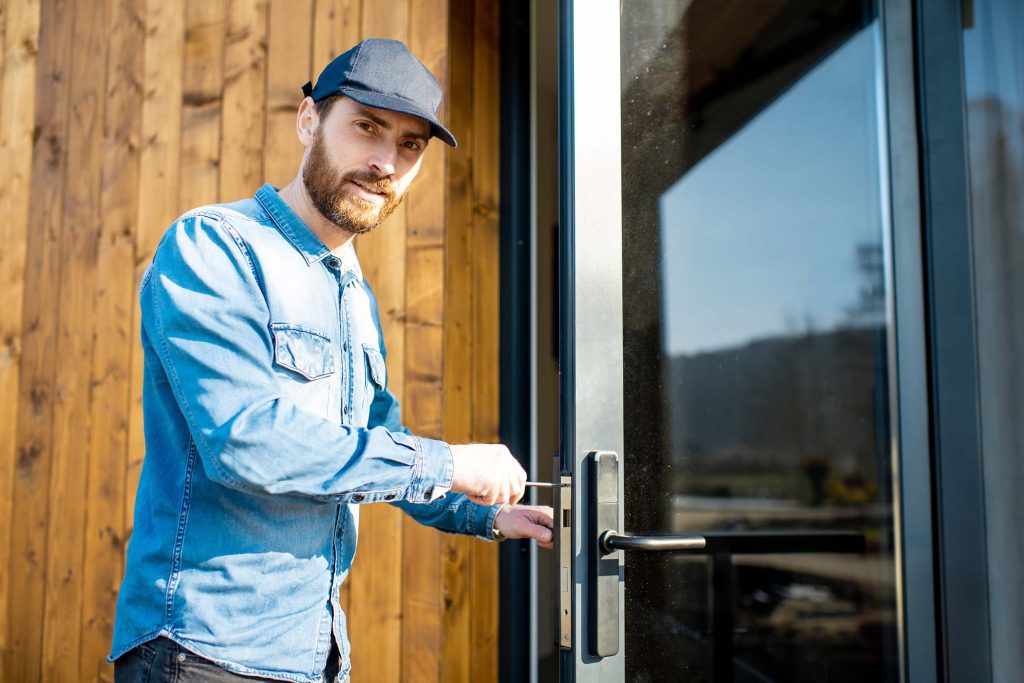 man-repairing-door-lock-XXTRAQU.jpg