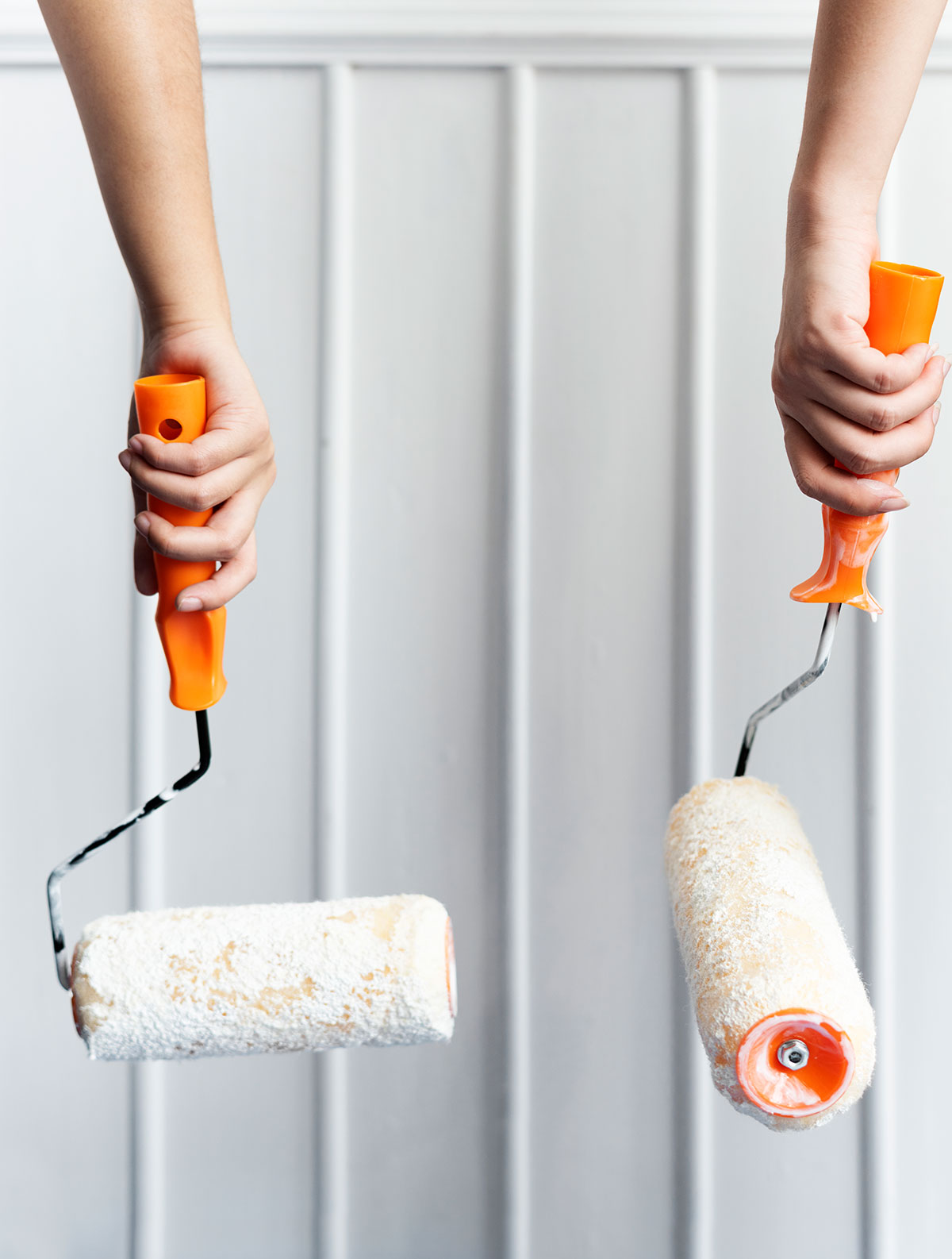 two-hands-painting-wall