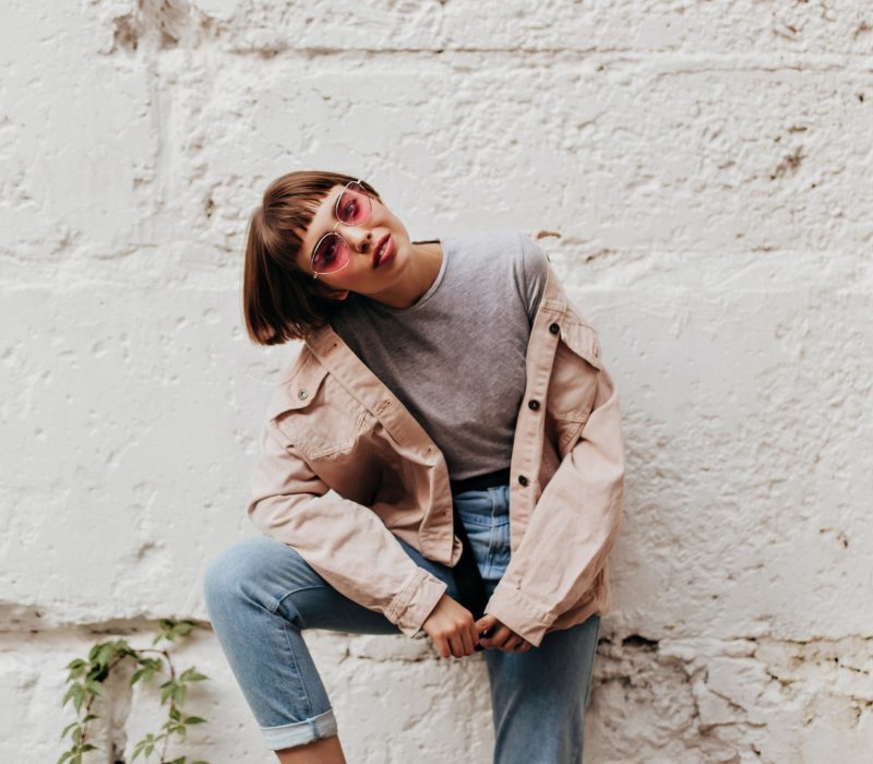 trendy-lady-with-pink-sunglasses-posing-outside-short-haired-girl-in-beige-jacket-jeans-and-t-shi.jpg