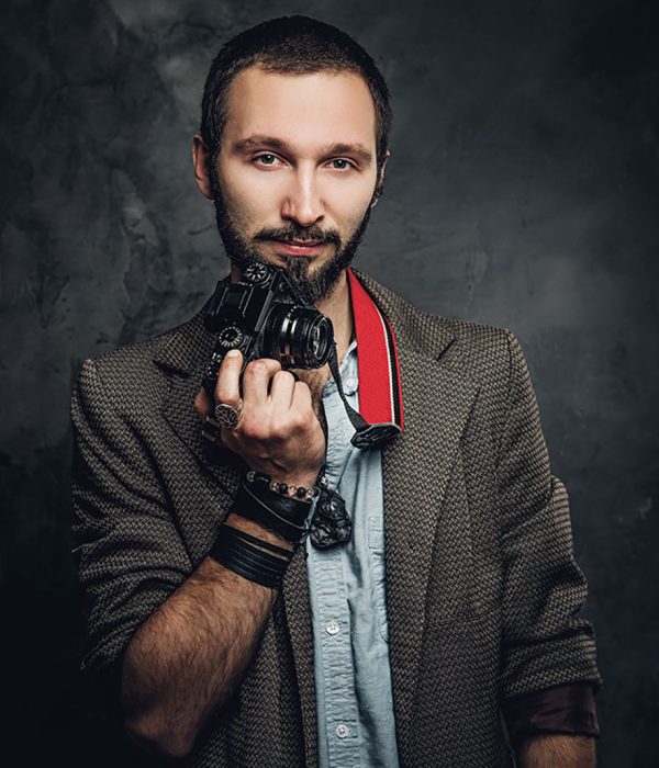 man-is-posing-for-photographer-with-photo-camera-resize.jpg