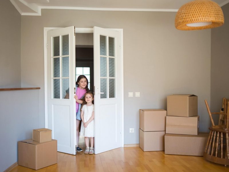 children-look-into-its-new-home-moving-to-apartment-boxes-in-house-1-1-pe7ens5cezcs7vvfkkzmoytpf4t2hh3xe1b3eo067k