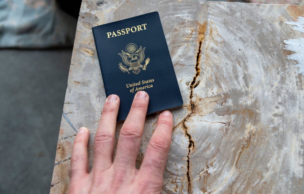 hand-on-passport-personal-perspective.jpg