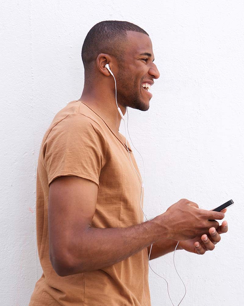 portrait-of-afro-american-man-listening-music-agai-CAJQK28.jpg